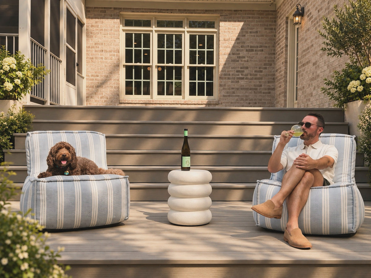 Cove Lounge Chair in Dobby Stripe Sunbrella upholstery styled outdoors
