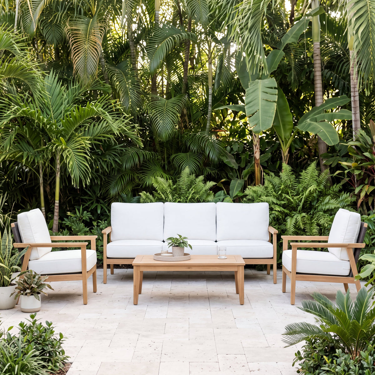 Royal Teak Collection Ventura 3-Piece Living Set on a stone terrace