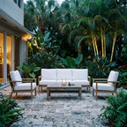 Royal Teak Collection Ventura 3-Piece Living Set (Sofa & 2 Club Chairs in White/Natural) on a Stone Terrace at Dusk