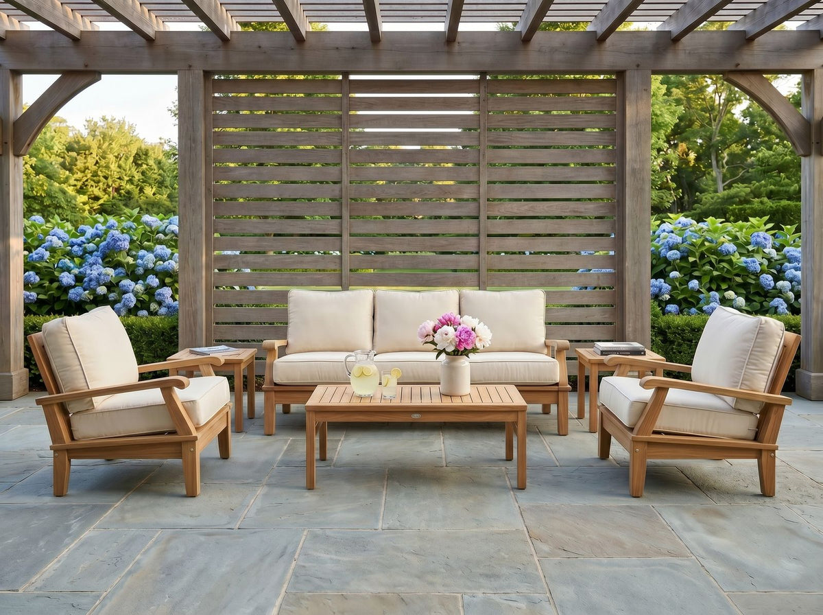 Miami teak seating with ivory cushions in a garden